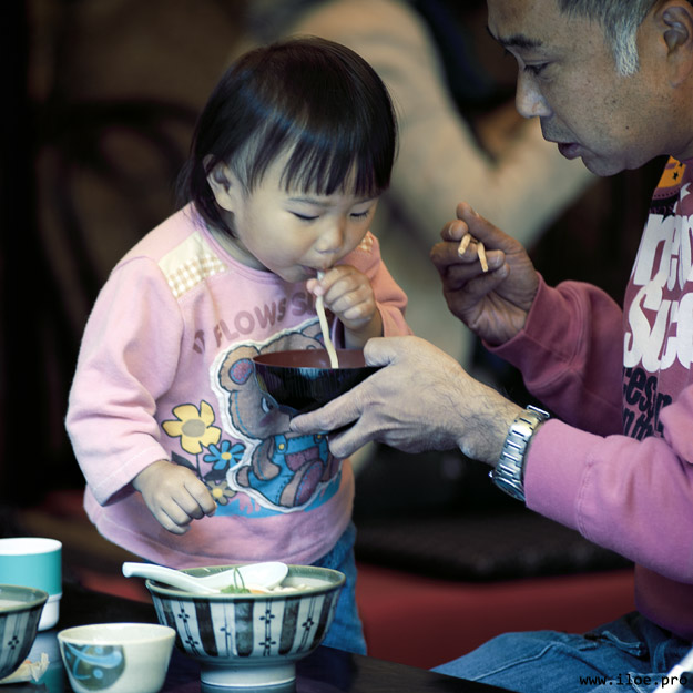 girl eating noodles